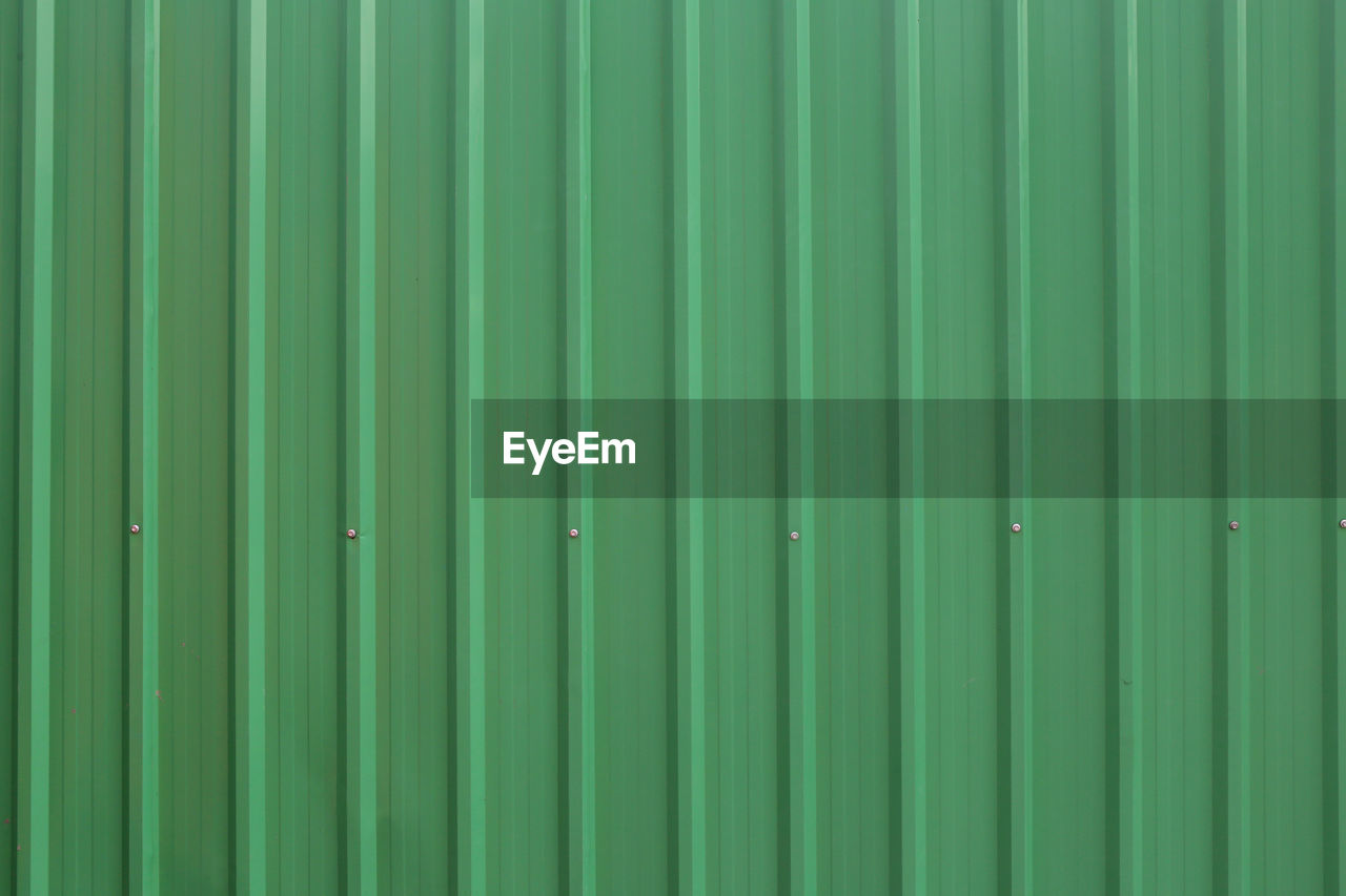 Green metal sheet wall background,galvanized texture backdrop for design in your work.