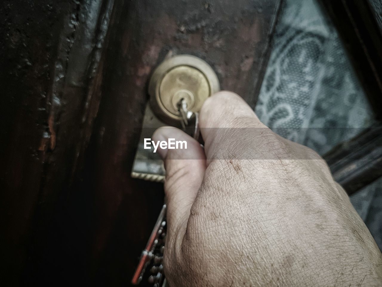 Close-up of hand opening the door 