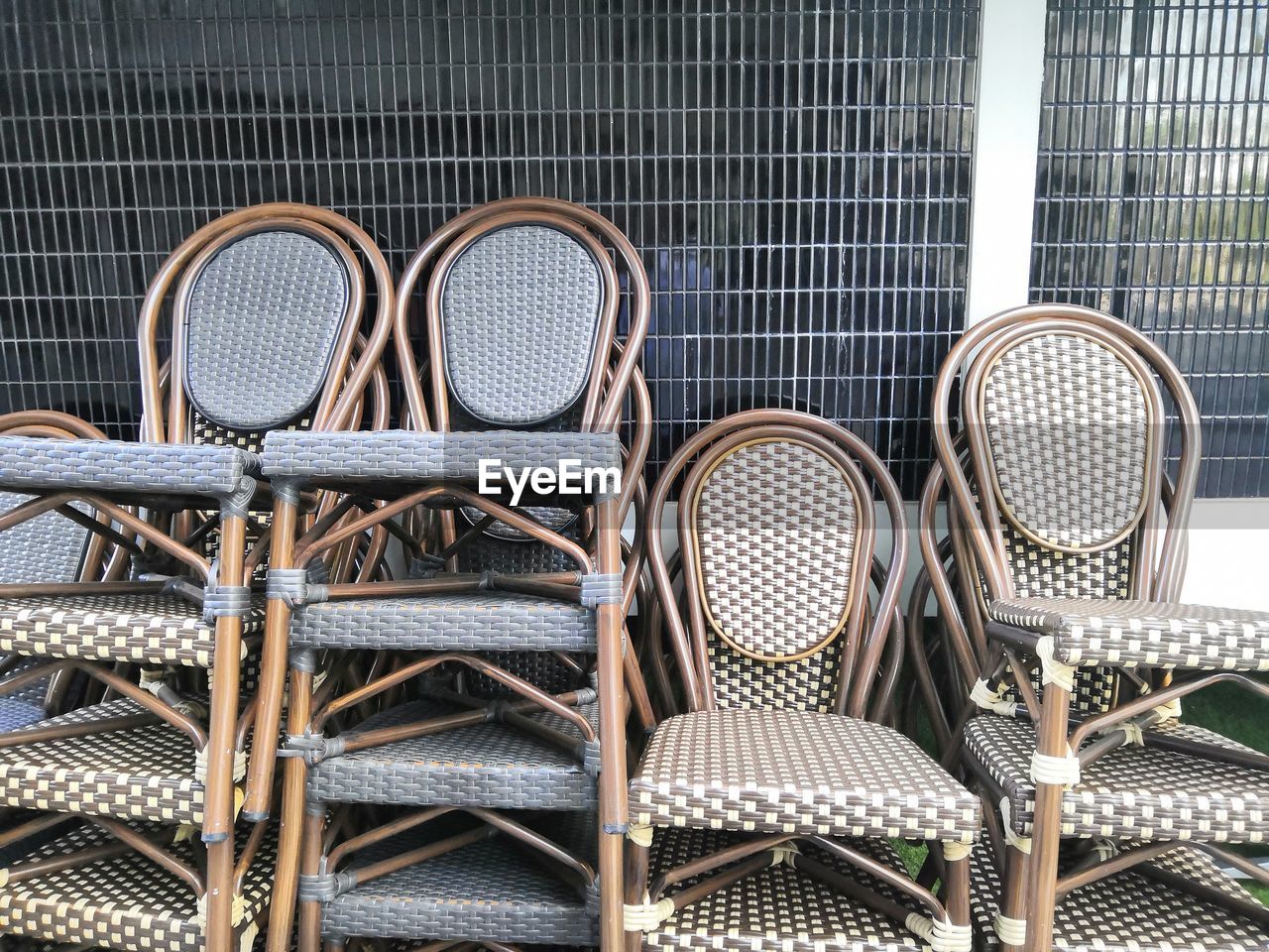 Close-up of empty chairs in rack