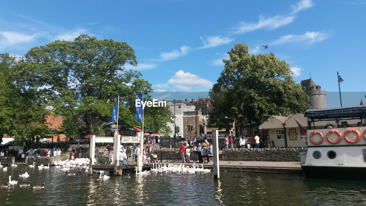 River against people walking on footpath