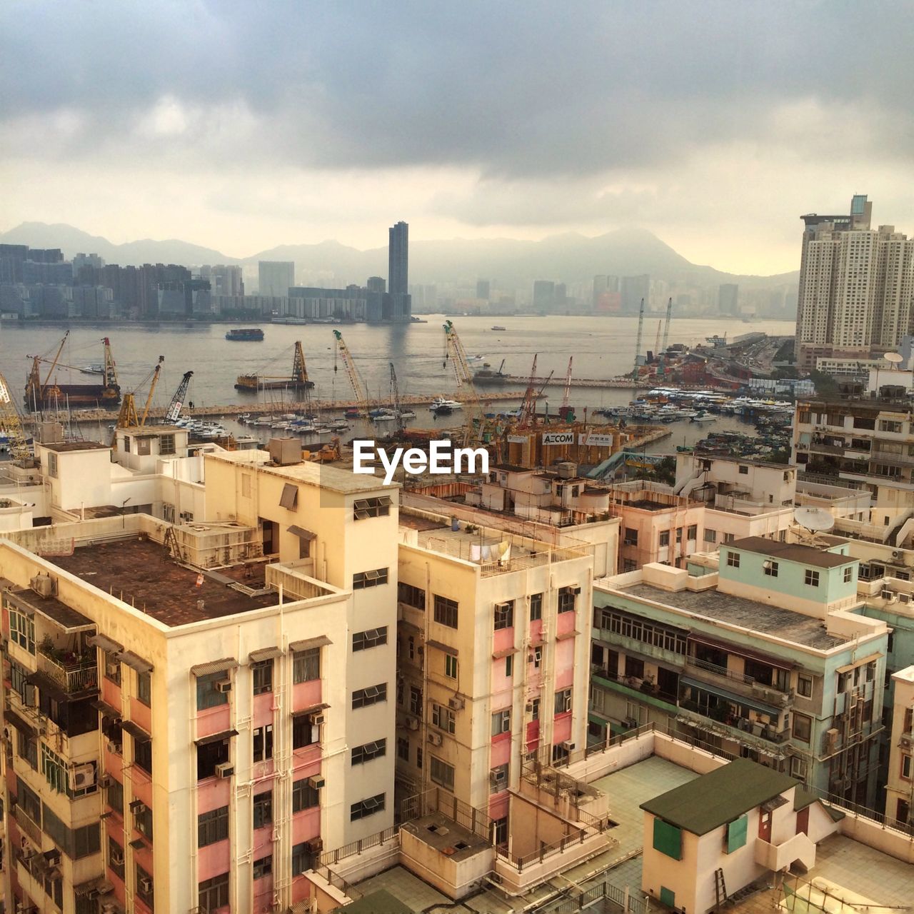 High angle view of residential buildings by commercial dock