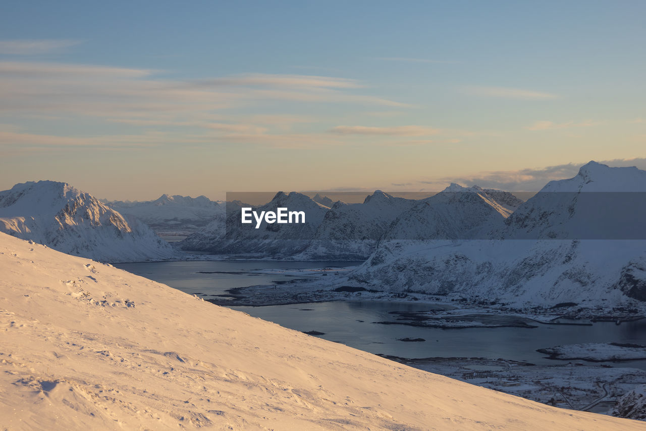 scenic view of snowcapped mountains against sky during winter