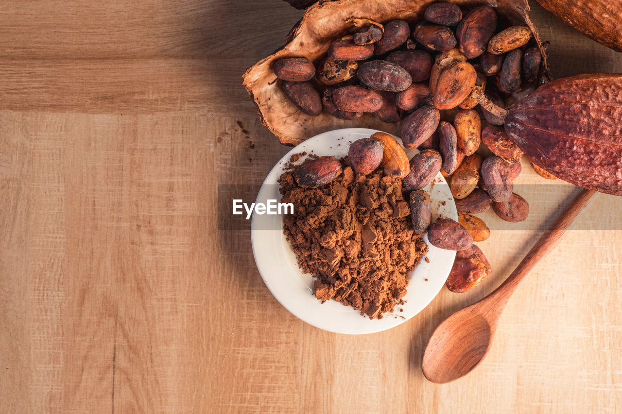 food and drink, food, freshness, healthy eating, wellbeing, wood, produce, indoors, table, brown, still life, high angle view, nuts & seeds, nut - food, no people, fruit, nut, studio shot, almond, dried fruit, directly above, dried food, breakfast, roasted coffee bean, ingredient, close-up, seed, drink, snack