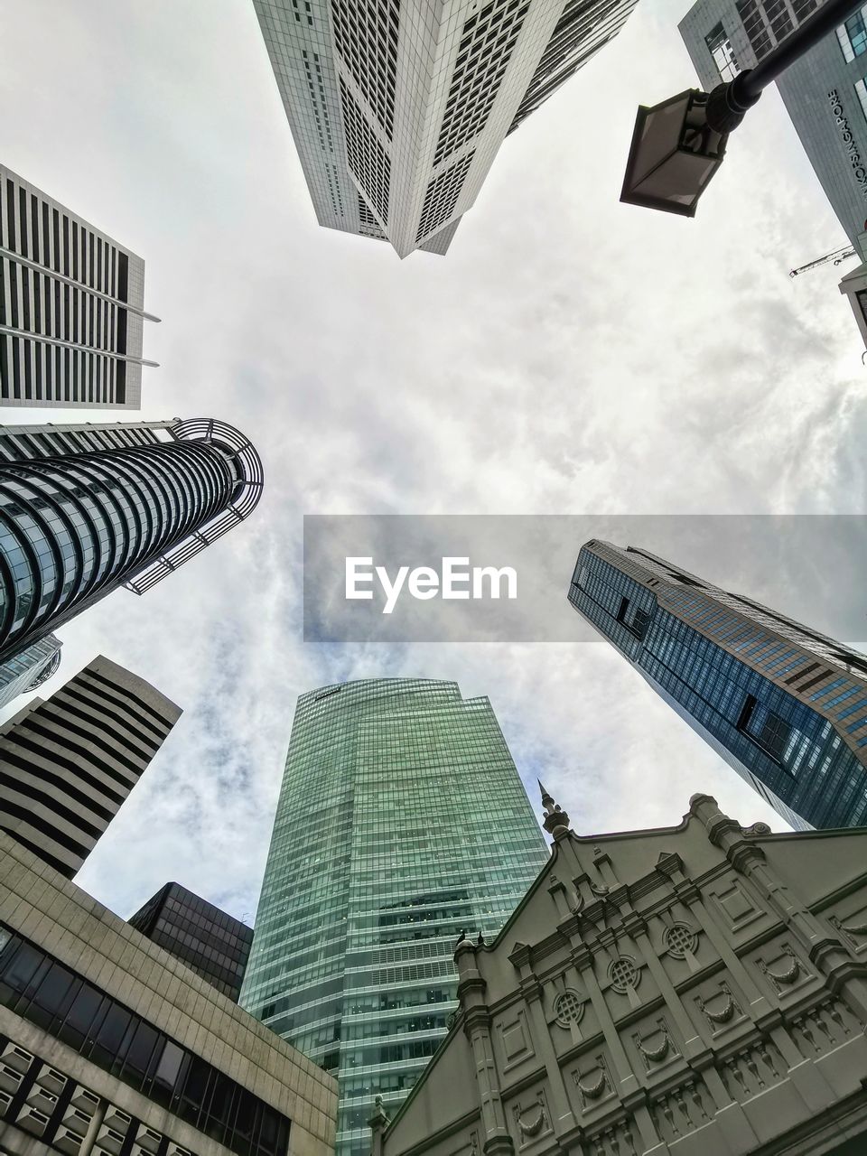 Look up view of commercial buildings against sky