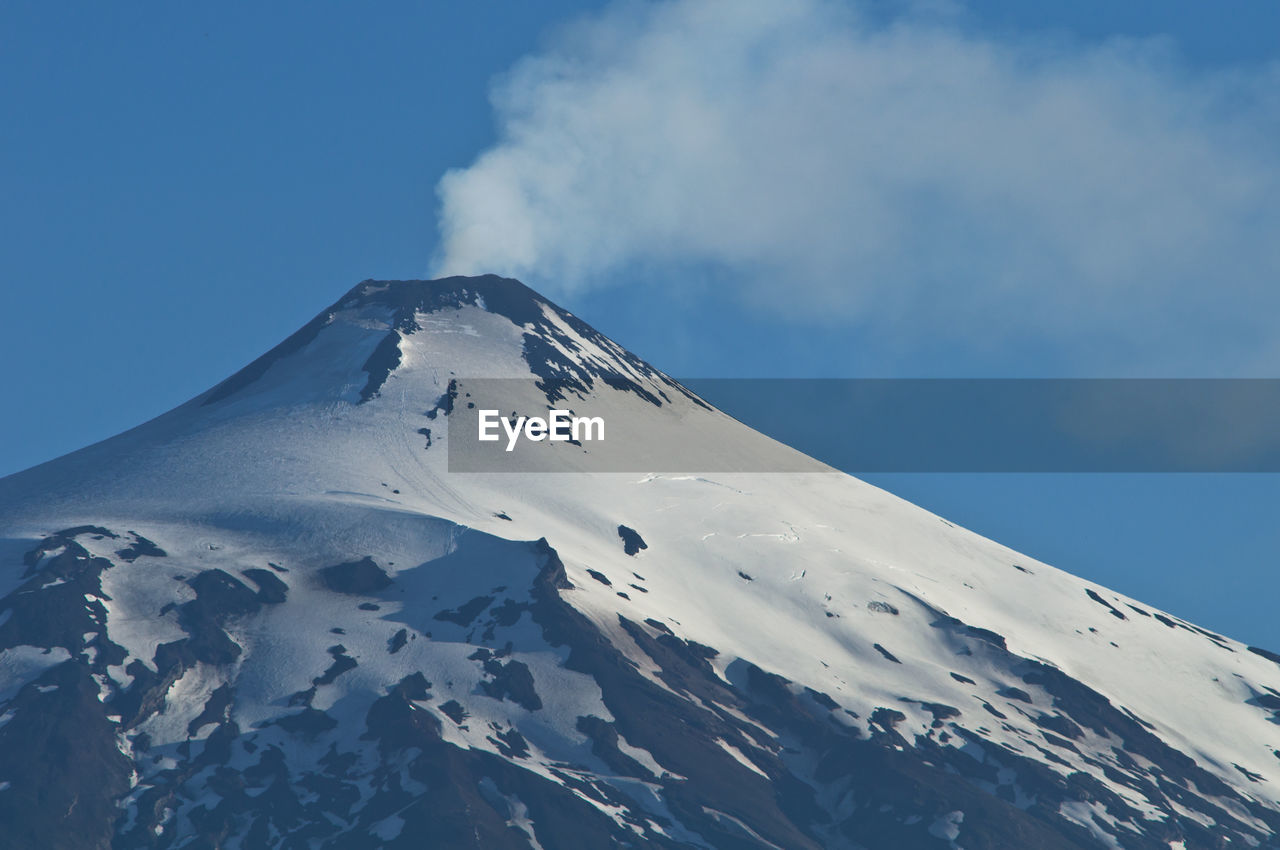 Scenic view of snow covered mountain against sky