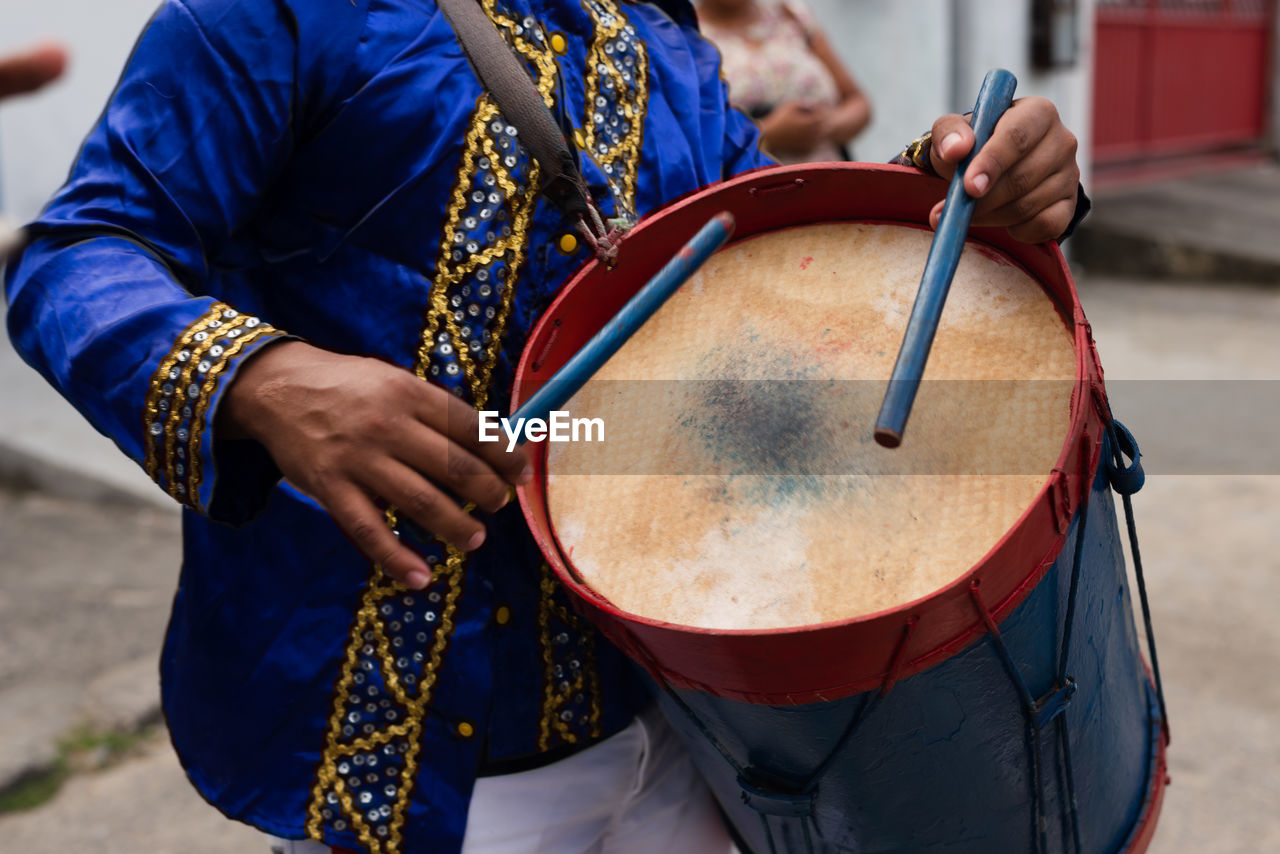 Members of a marujada, play percussion instruments during a parade at the chegancas meeting 