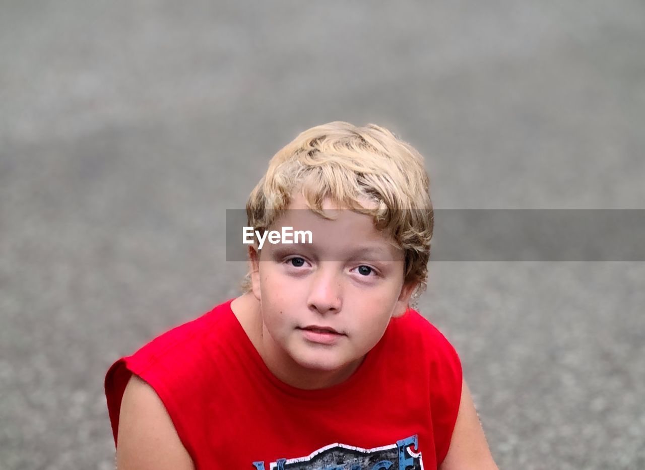 child, childhood, portrait, men, one person, teenager, blond hair, looking at camera, portrait photography, red, person, front view, toddler, headshot, casual clothing, serious, emotion, human face, day, sports, smiling, t-shirt, waist up, fun, spring, human hair, female