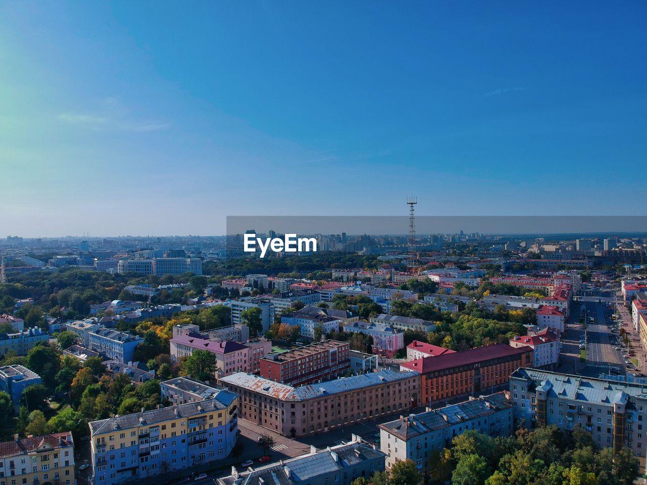 High angle view of townscape against blue sky