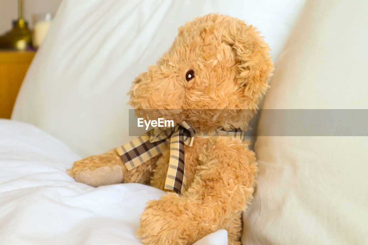 Close-up of stuffed toy on bed