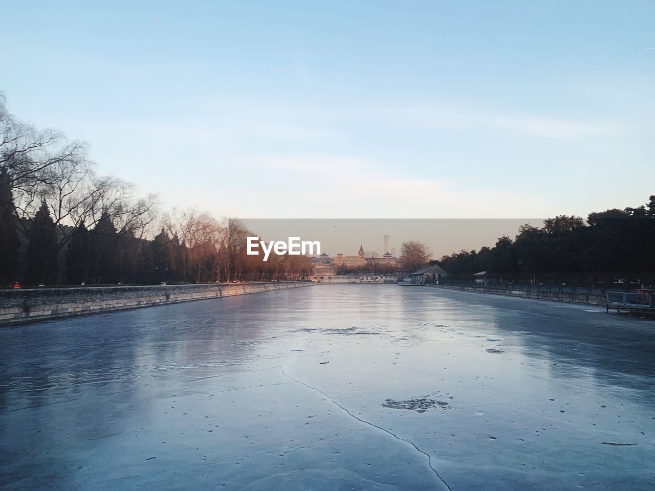 FROZEN LAKE AGAINST SKY