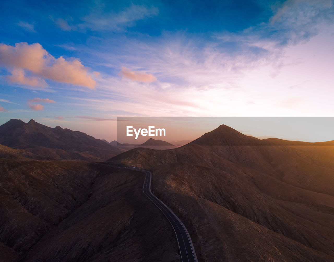 Scenic view of mountains against sky during sunset