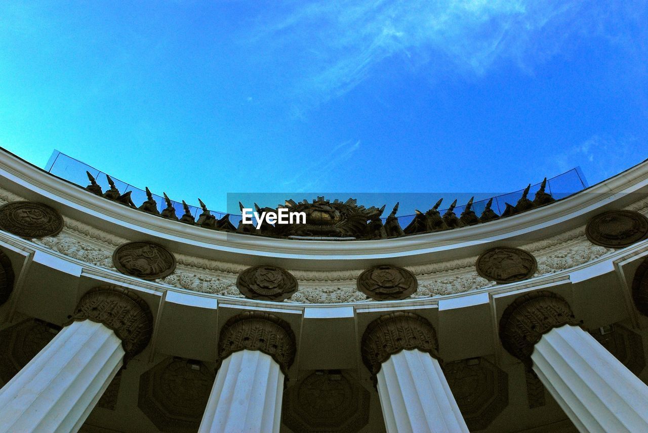 LOW ANGLE VIEW OF BUILT STRUCTURES AGAINST BLUE SKY