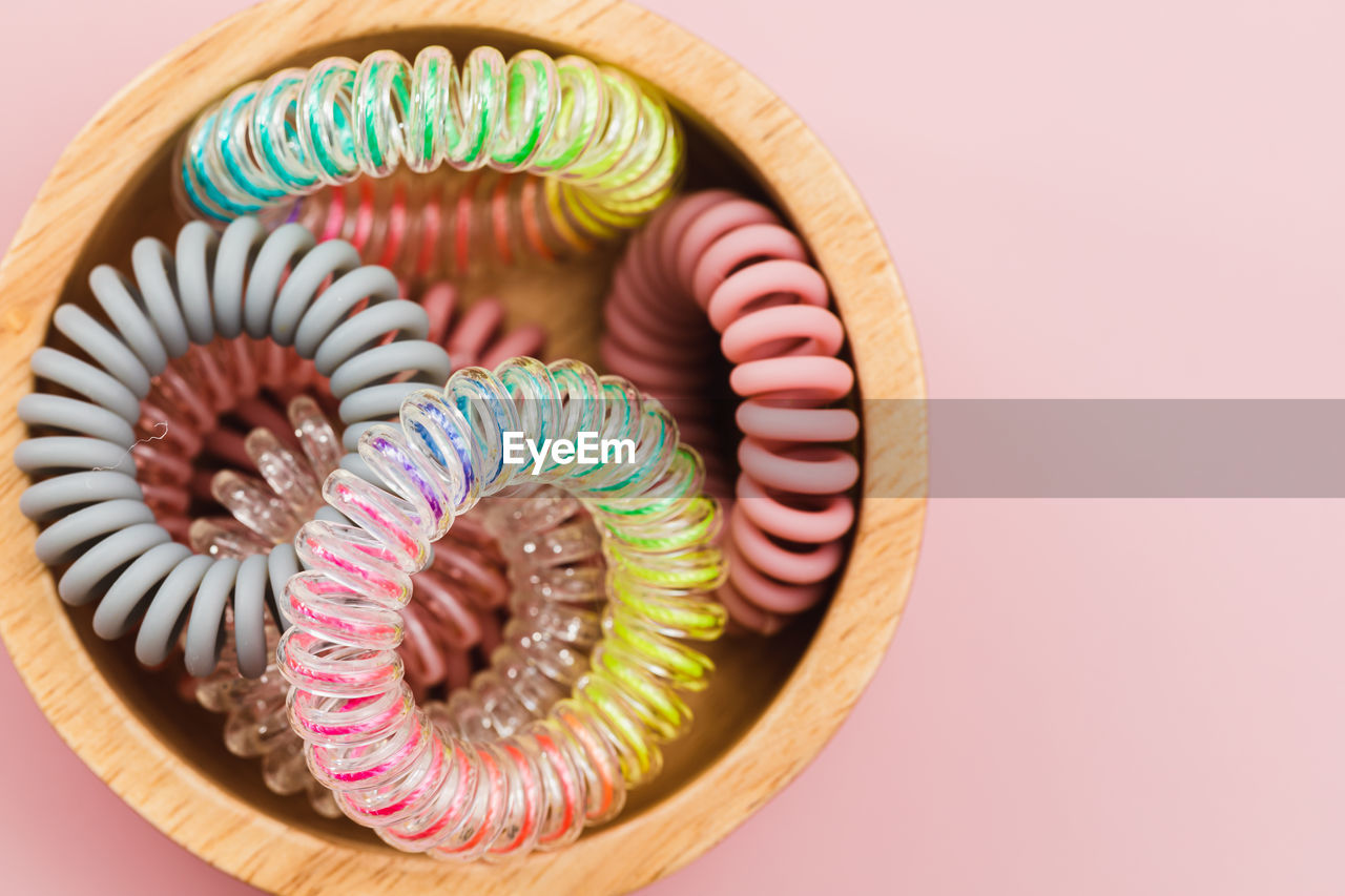 HIGH ANGLE VIEW OF MULTI COLORED CANDIES ON BACKGROUND