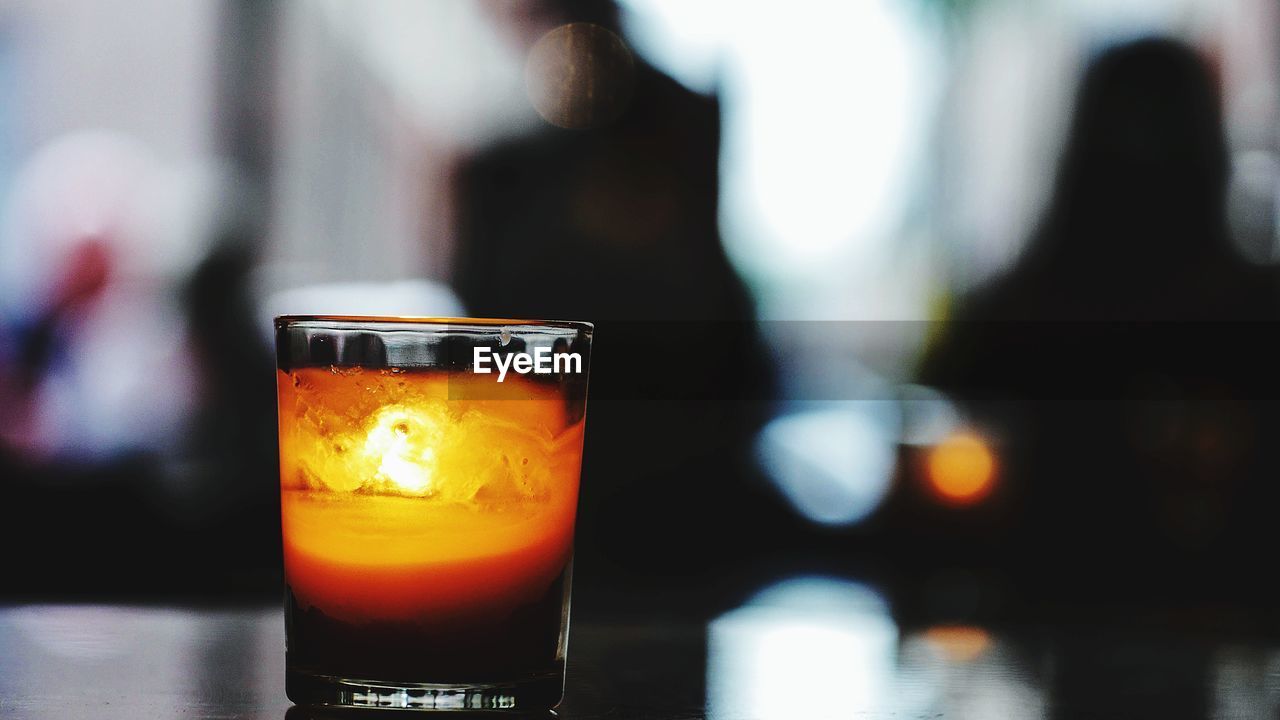 CLOSE-UP OF DRINK ON TABLE