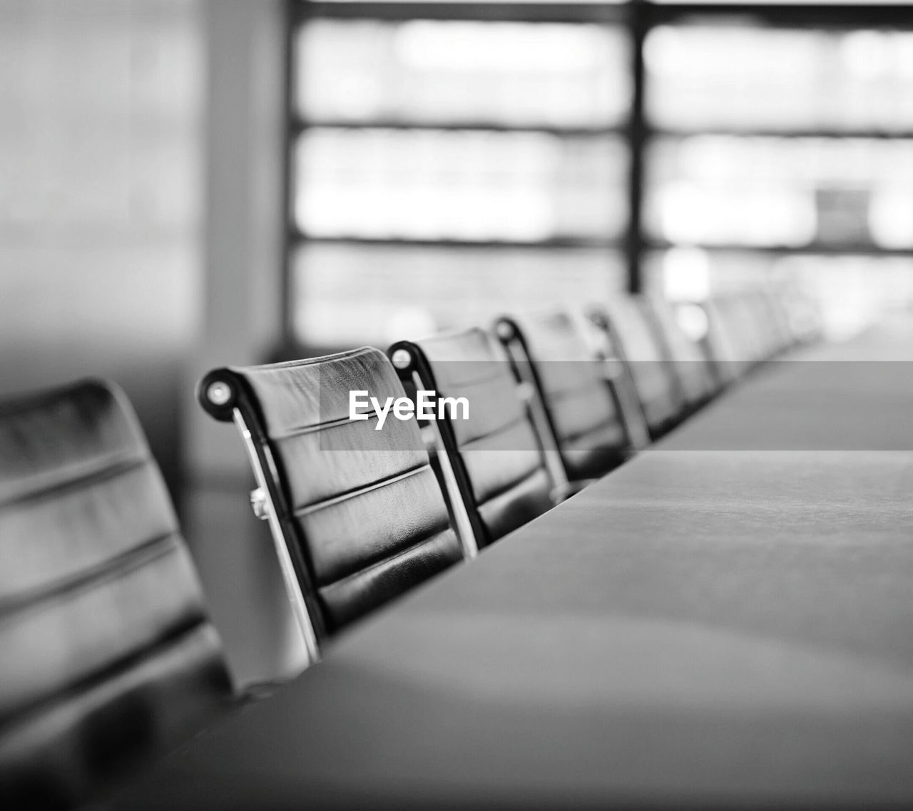 Empty chairs arranged in office