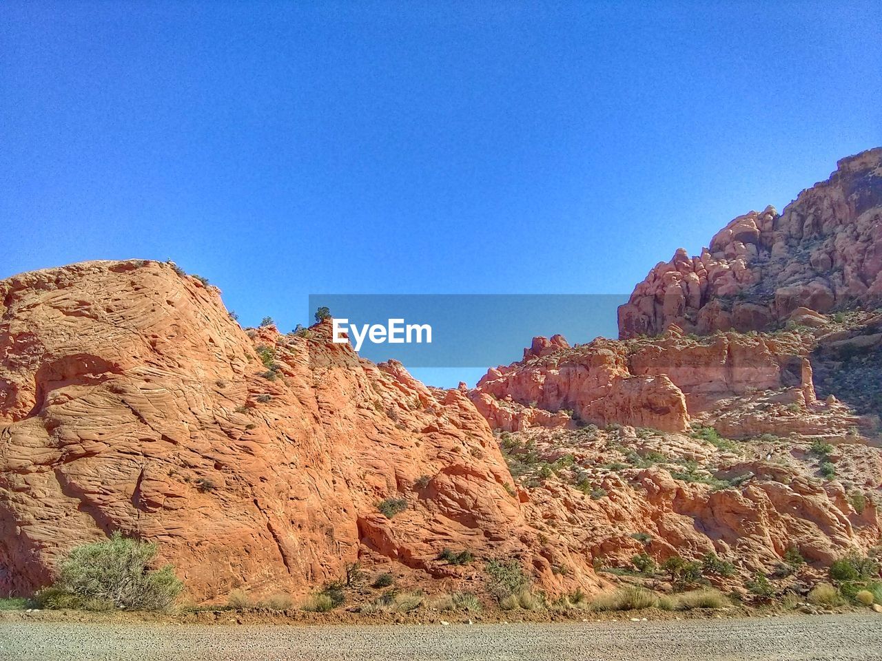 ROCK FORMATIONS ON LANDSCAPE AGAINST CLEAR SKY