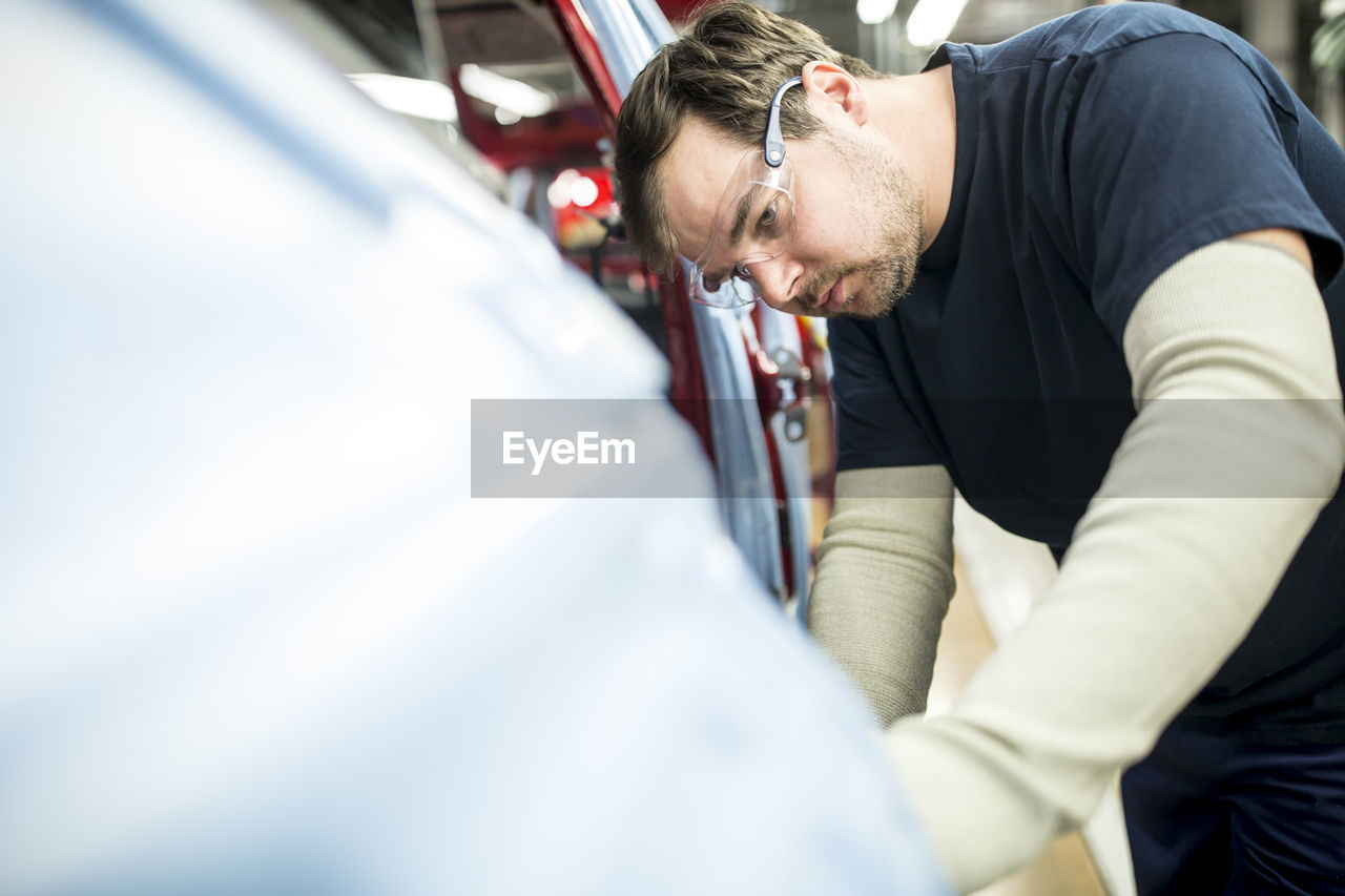Man working in modern car factory