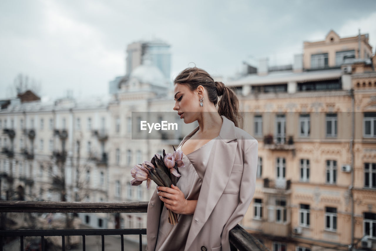 Young woman looking at city