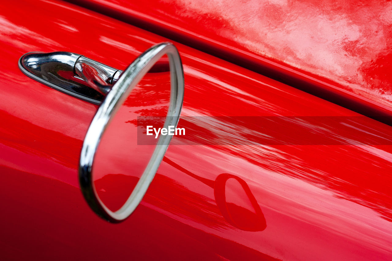 Close-up of red vintage car