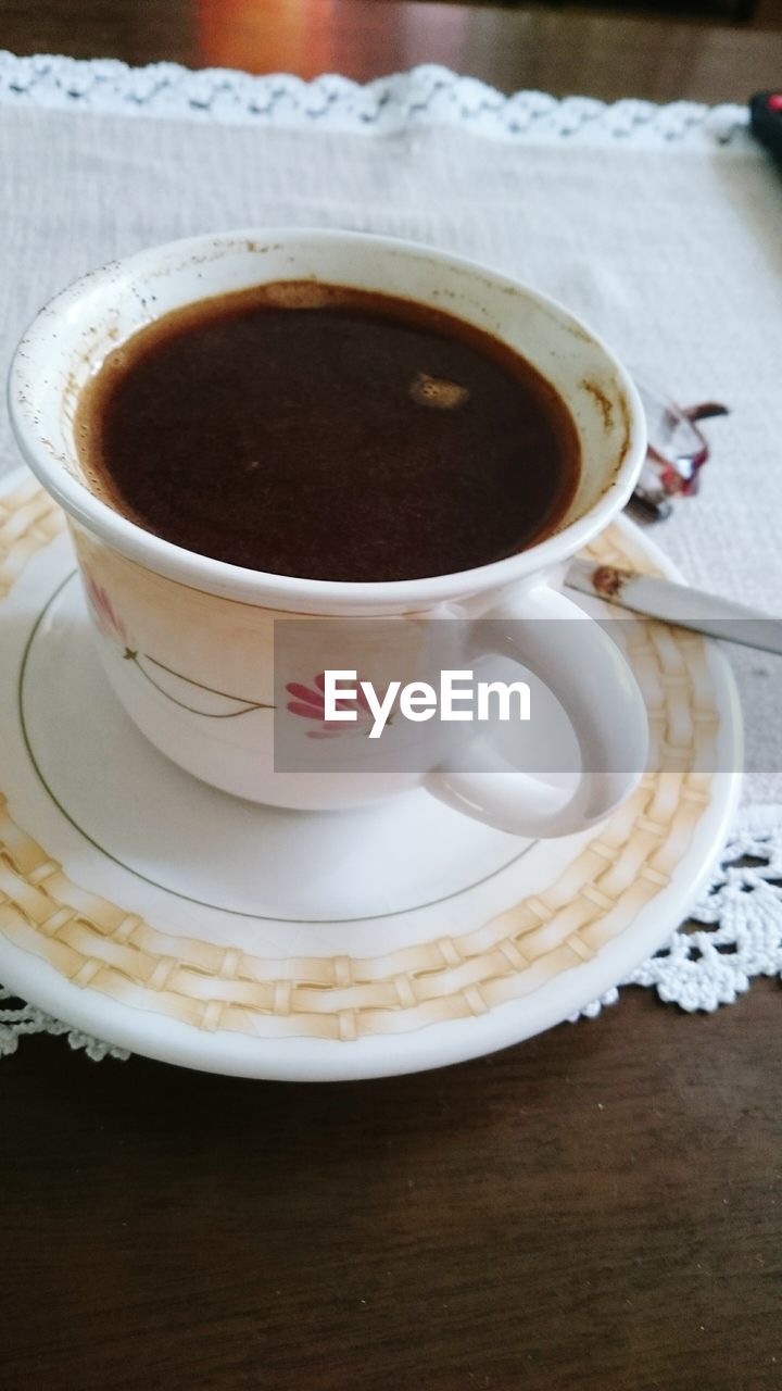 Close-up of black coffee on table