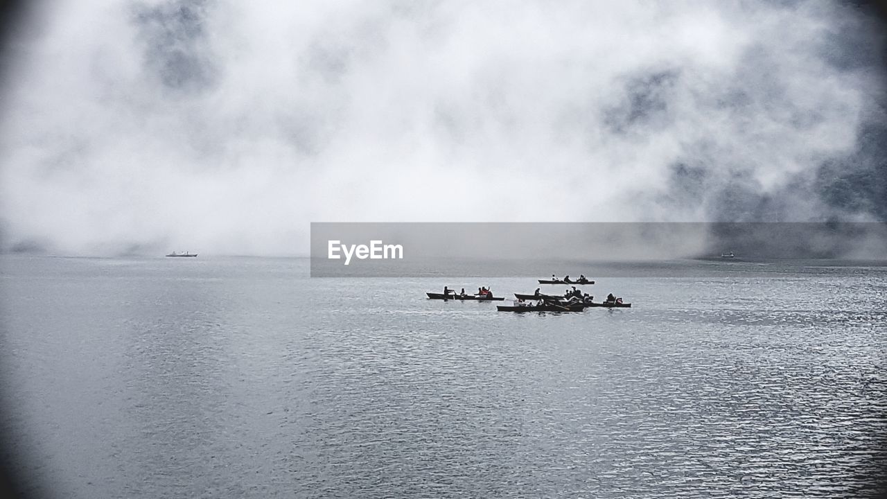 NAUTICAL VESSEL SAILING ON SEA AGAINST SKY