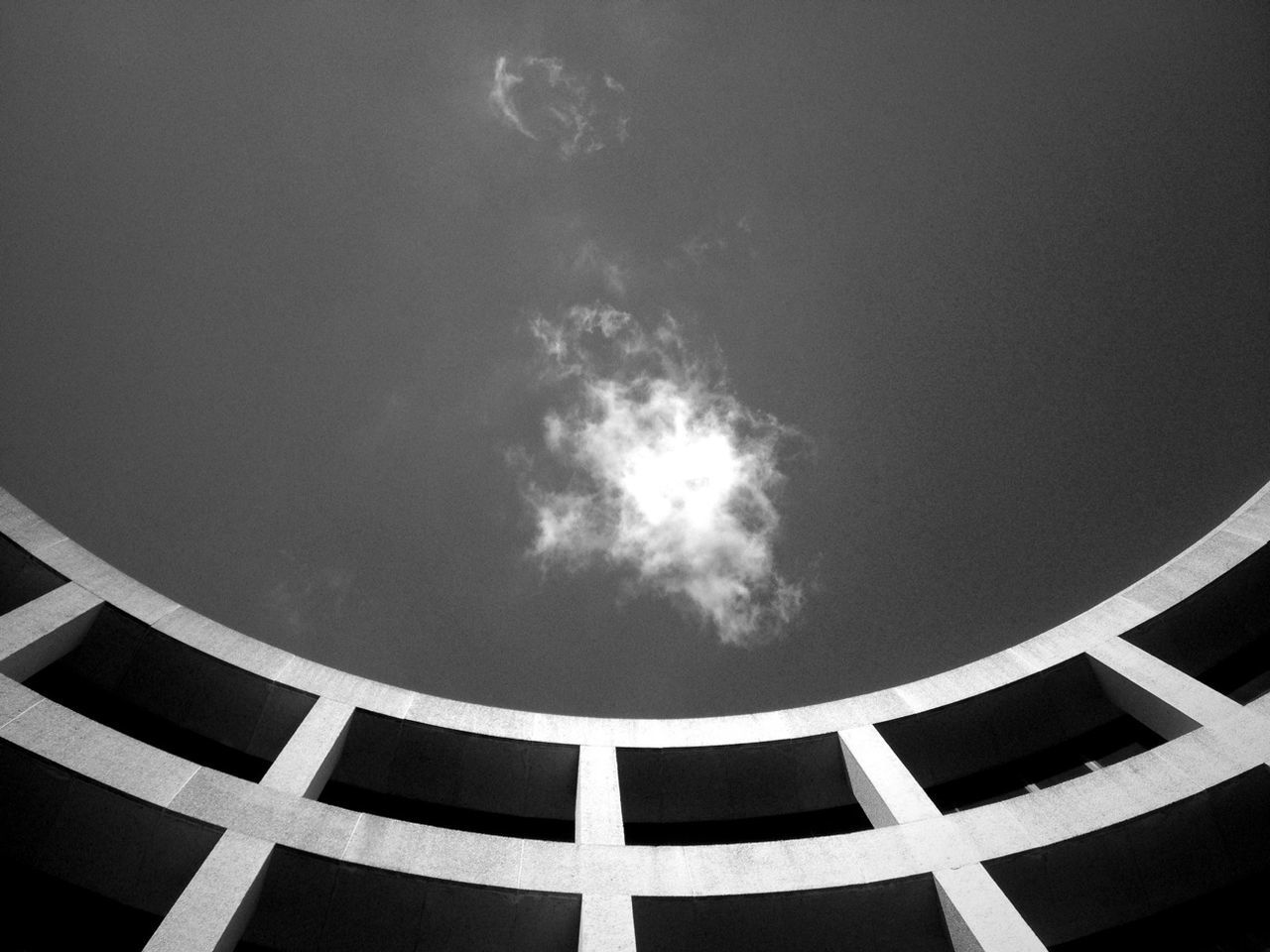 Low angle view of wall against the sky and clouds