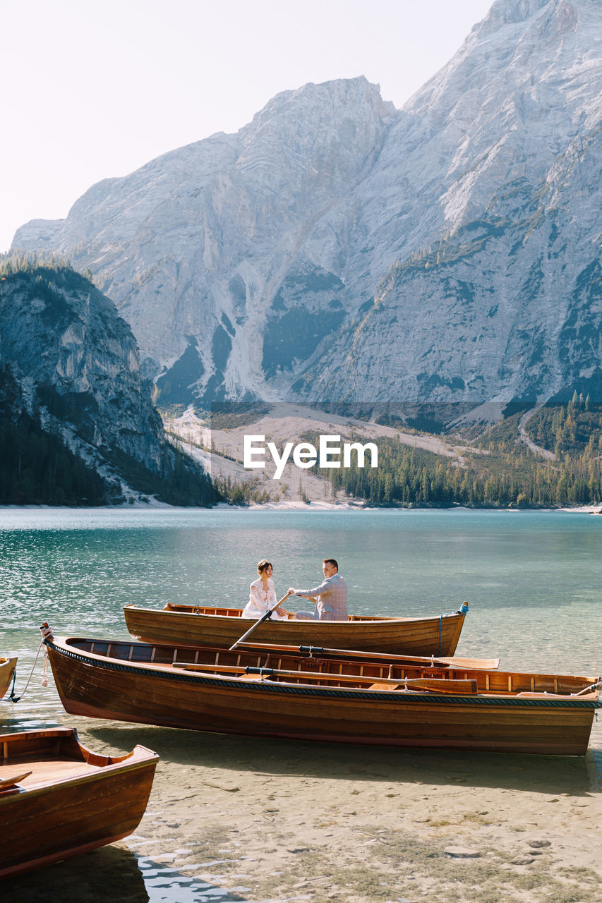 SCENIC VIEW OF LAKE AGAINST MOUNTAIN