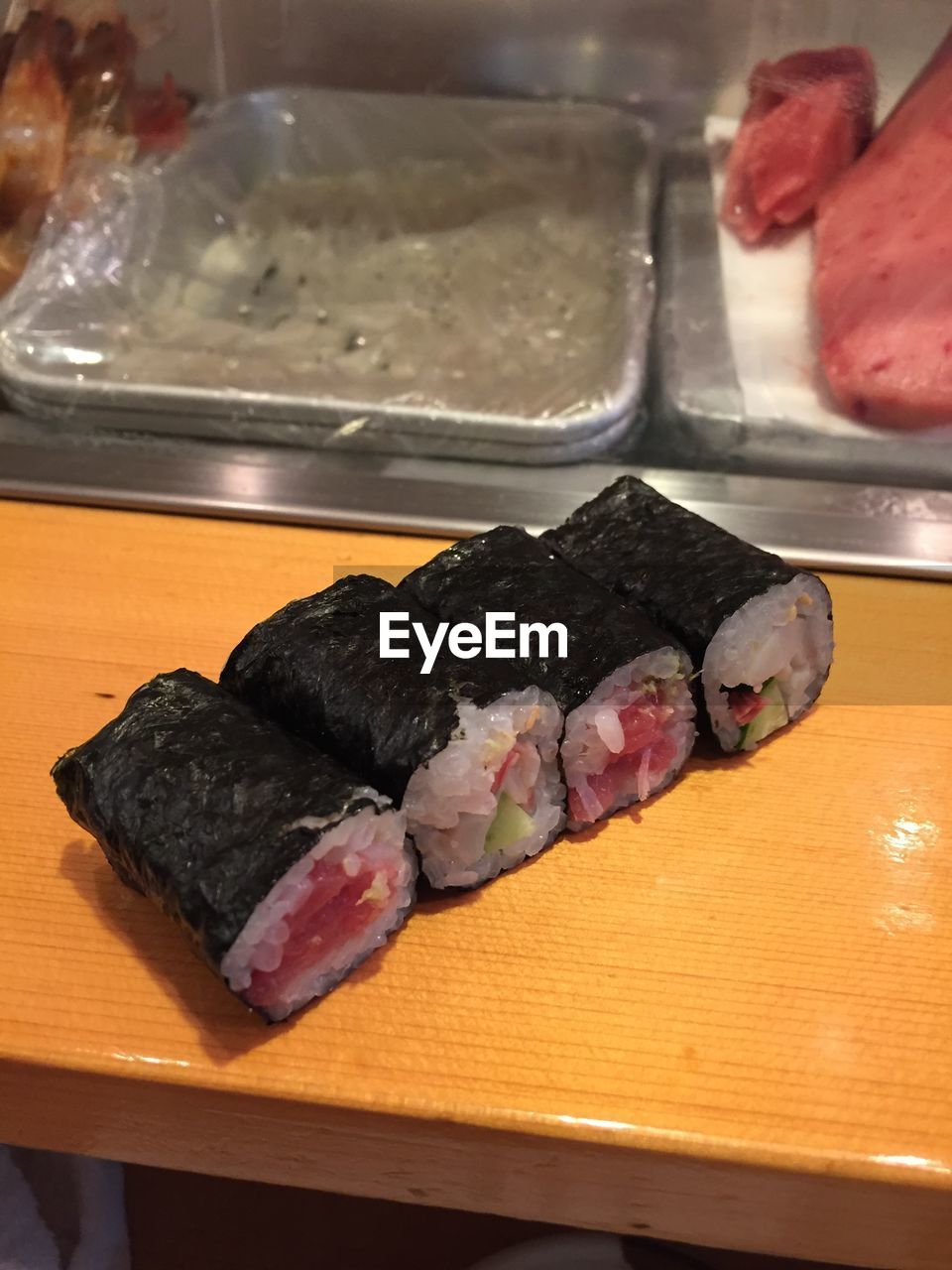 Close-up of sushi on wooden table