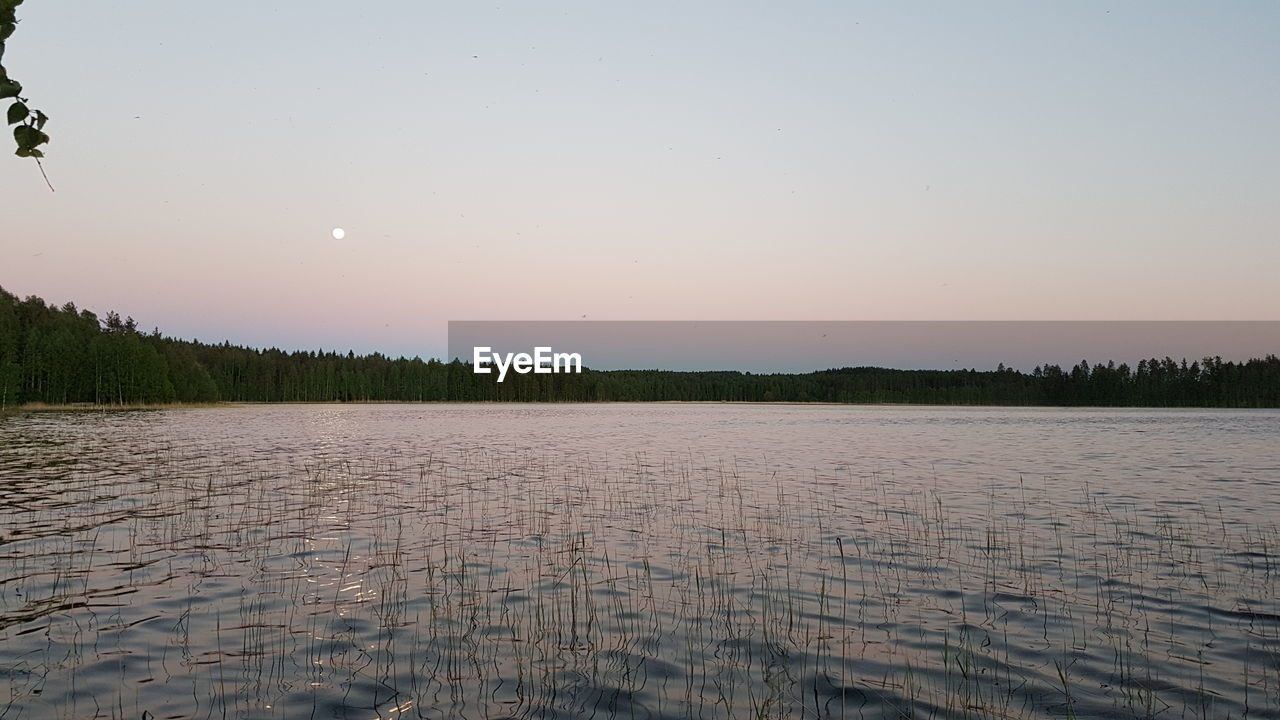 SCENIC VIEW OF LAKE AGAINST CLEAR SKY