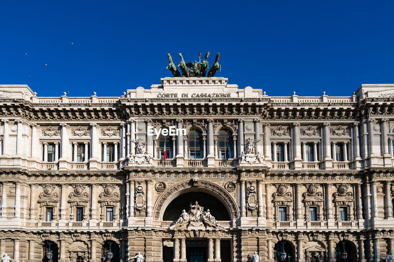 low angle view of historic building against clear blue sky