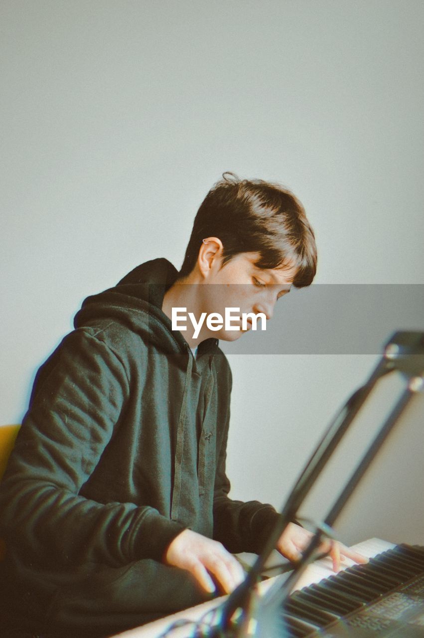 Man playing piano at home