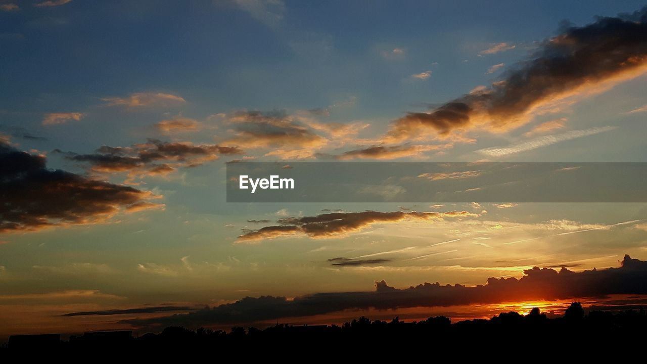 Scenic view of silhouette landscape against sky during sunset