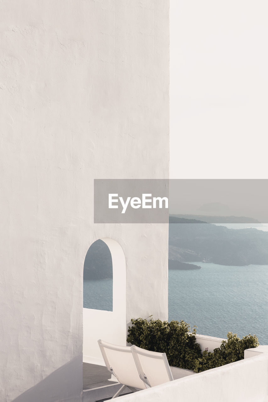 White house in santorini with view on the caldera, cyclades, greece