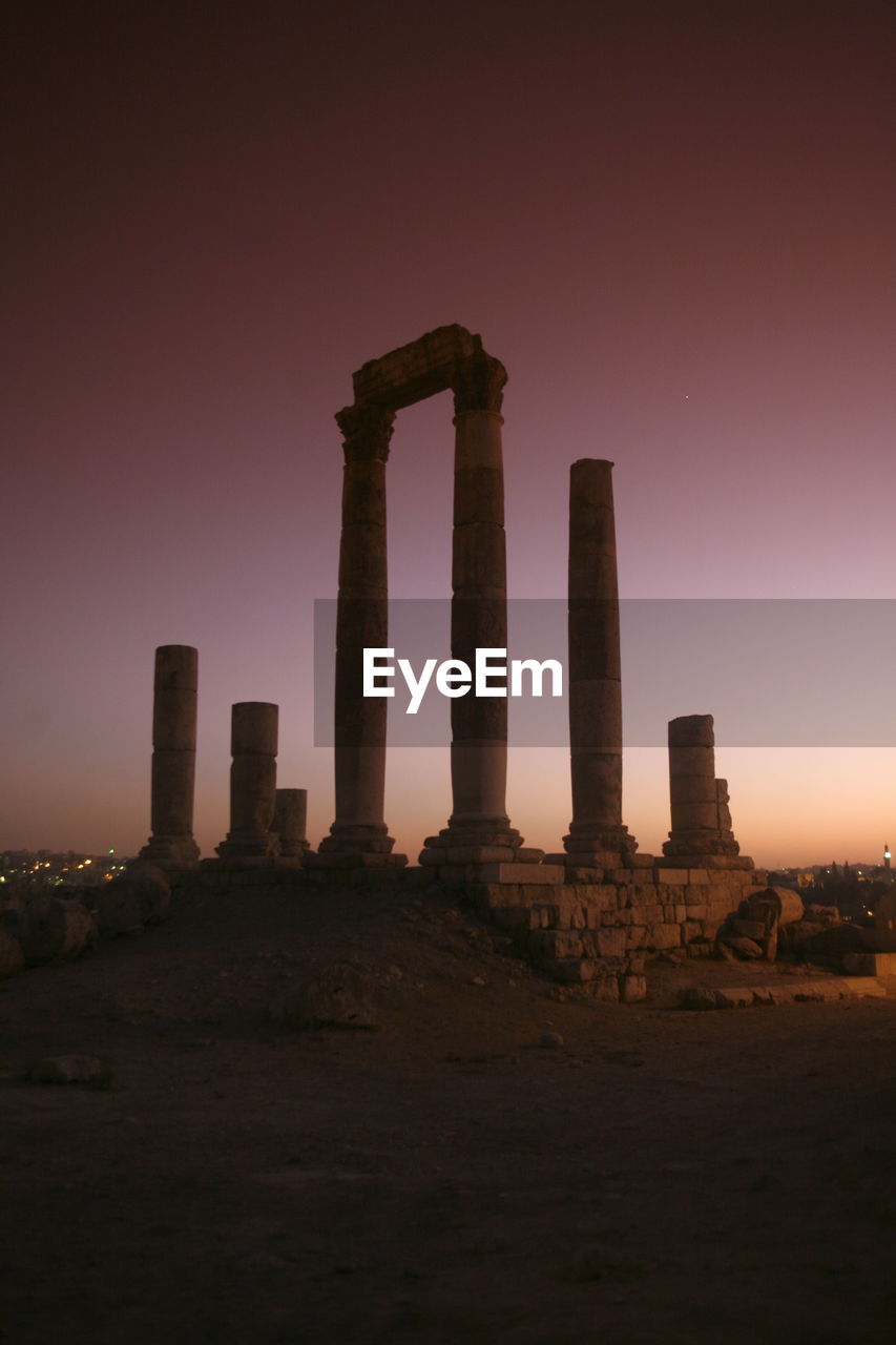 View of old ruins against sky during sunset