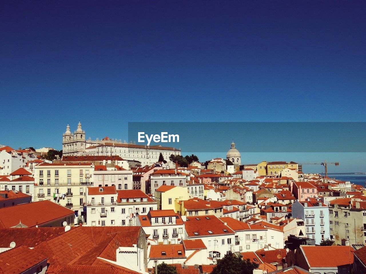 Sao jorge castle in town against clear blue sky