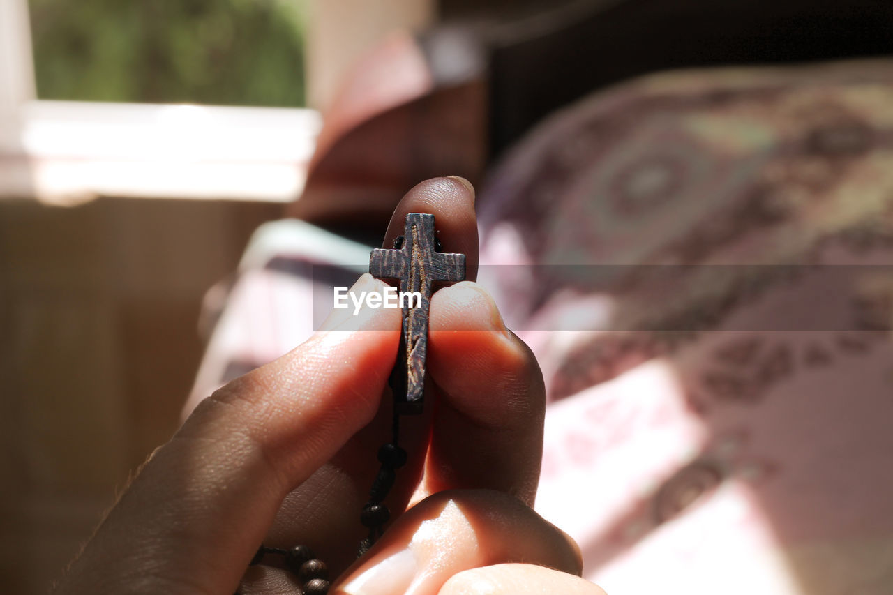 Close-up of person holding cigarette