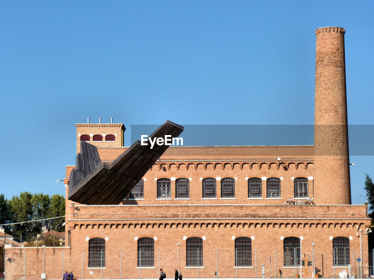 Low angle view of built structure against clear blue sky