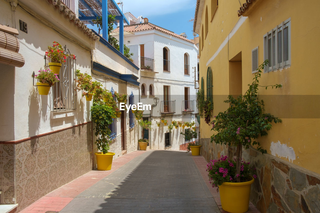 The narrow streets of estepona, spain, each street has flower pots of a different colour.