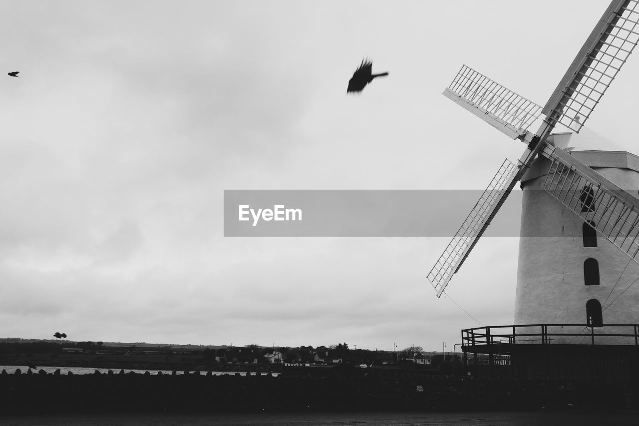 Traditional windmill against sky