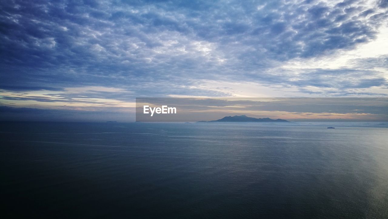 Scenic view of sea against sky at sunset