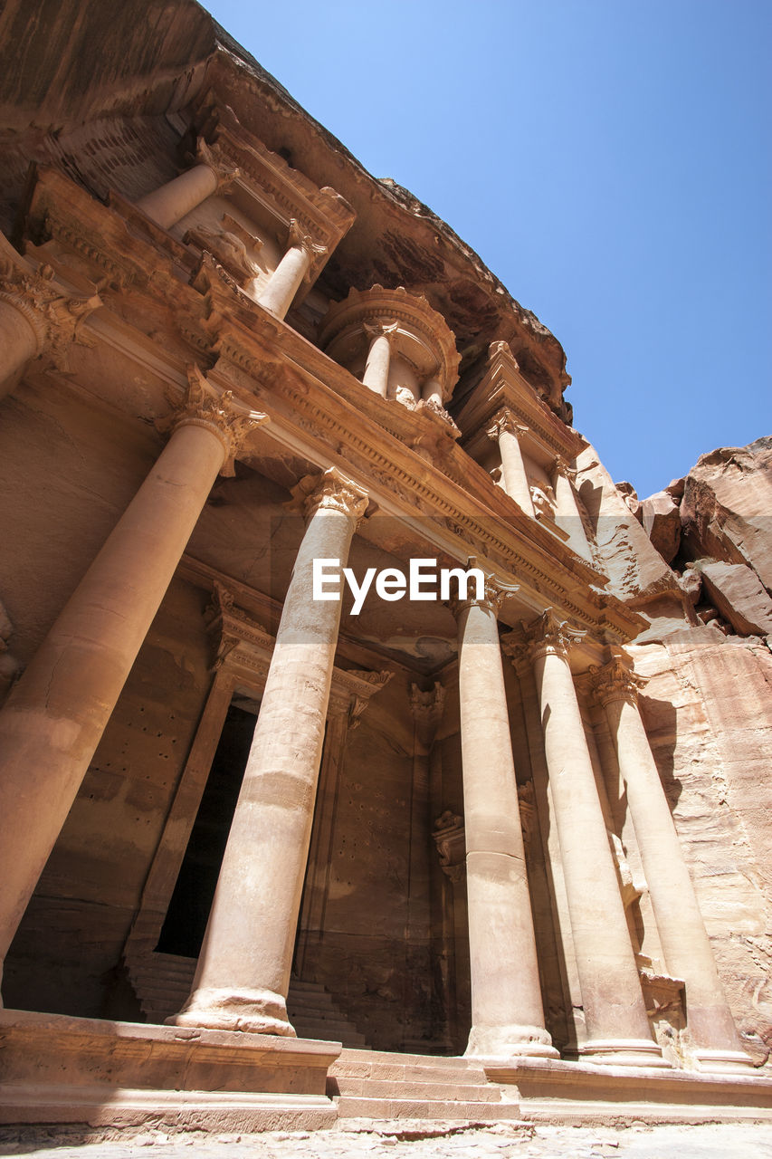 Low angle view of old ruins against clear sky