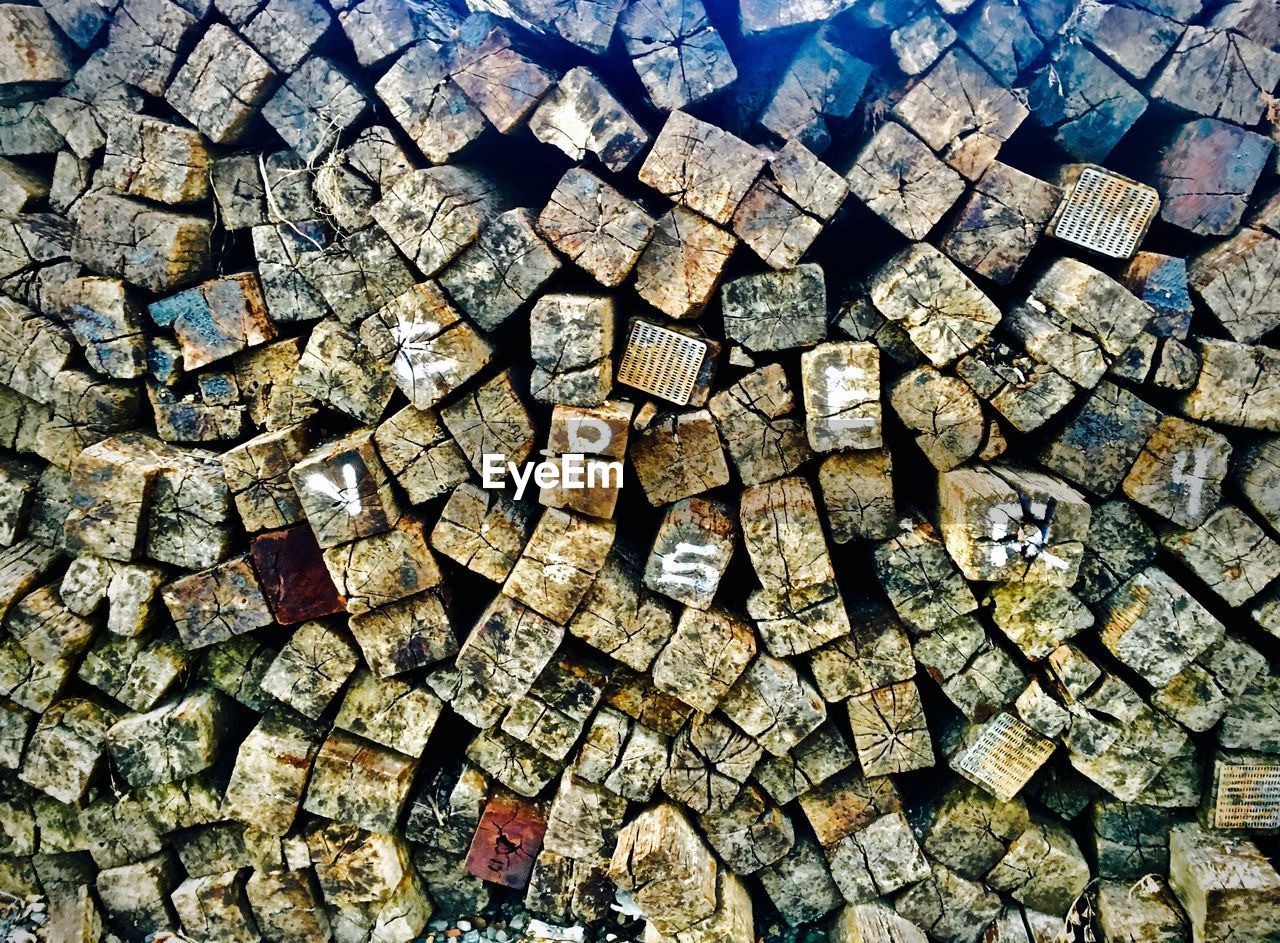 FULL FRAME SHOT OF LOGS STACK