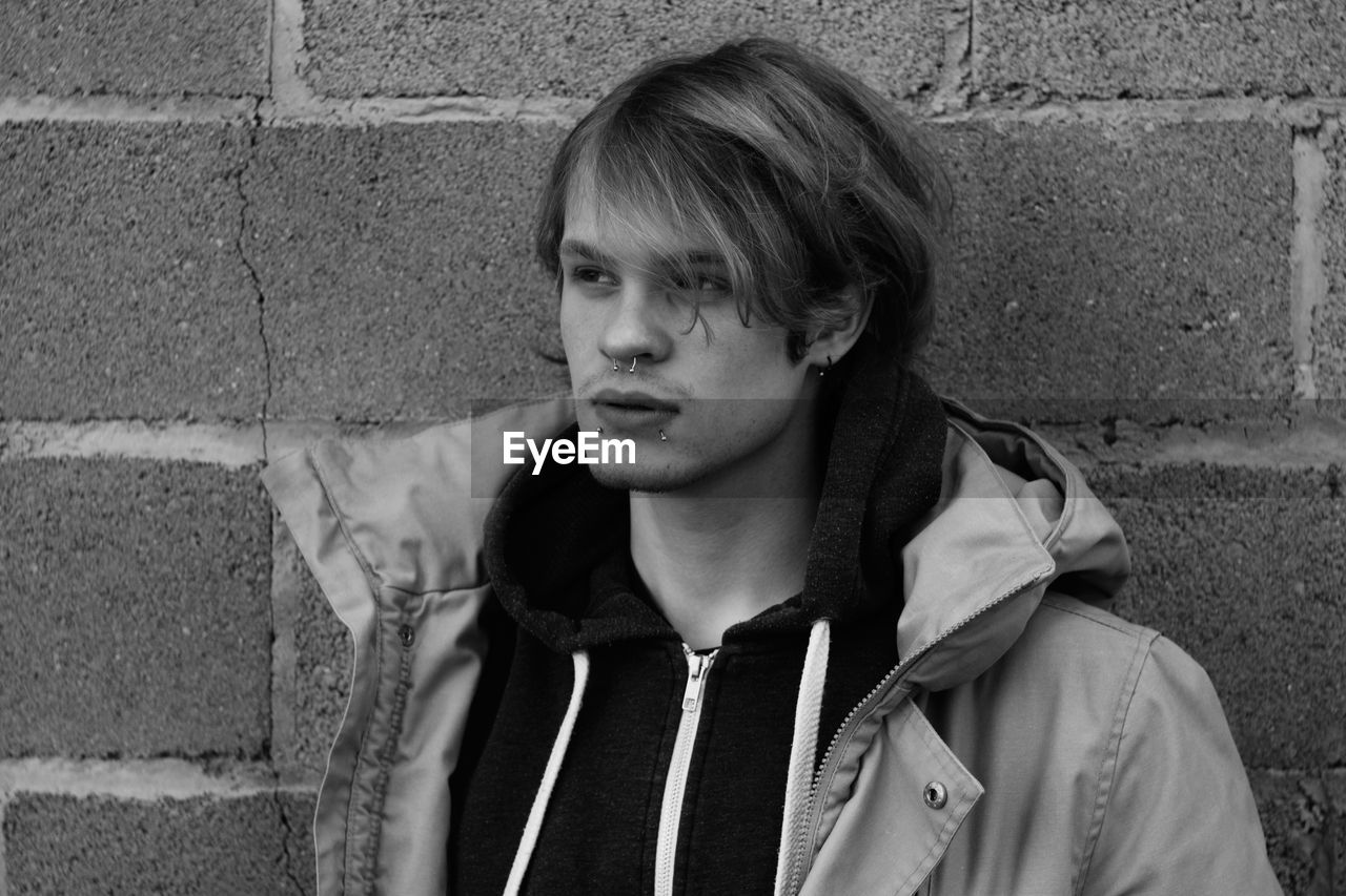 Close-up of young man with piercings