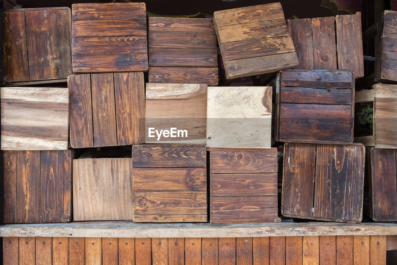 Full frame shot of wooden stools for sale at market