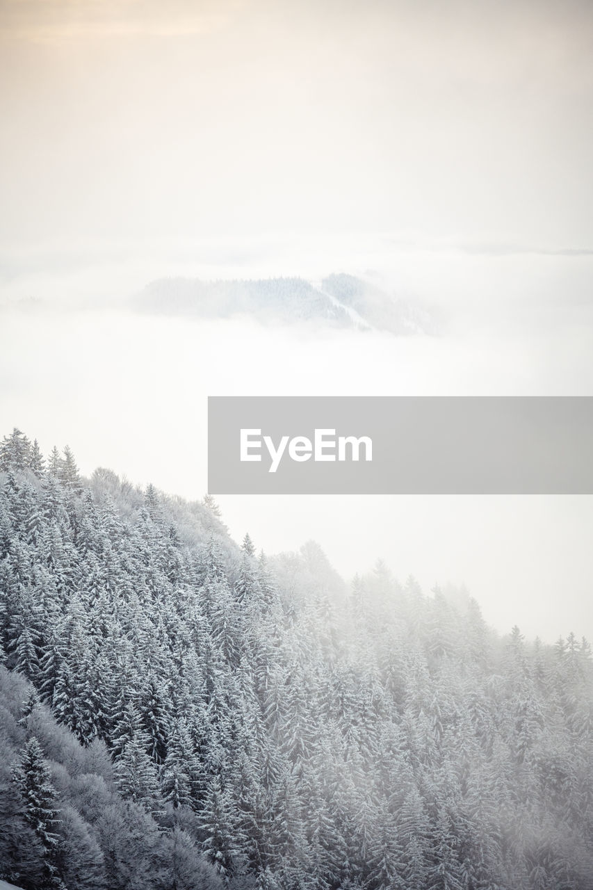 Scenic view of mountains against sky during winter