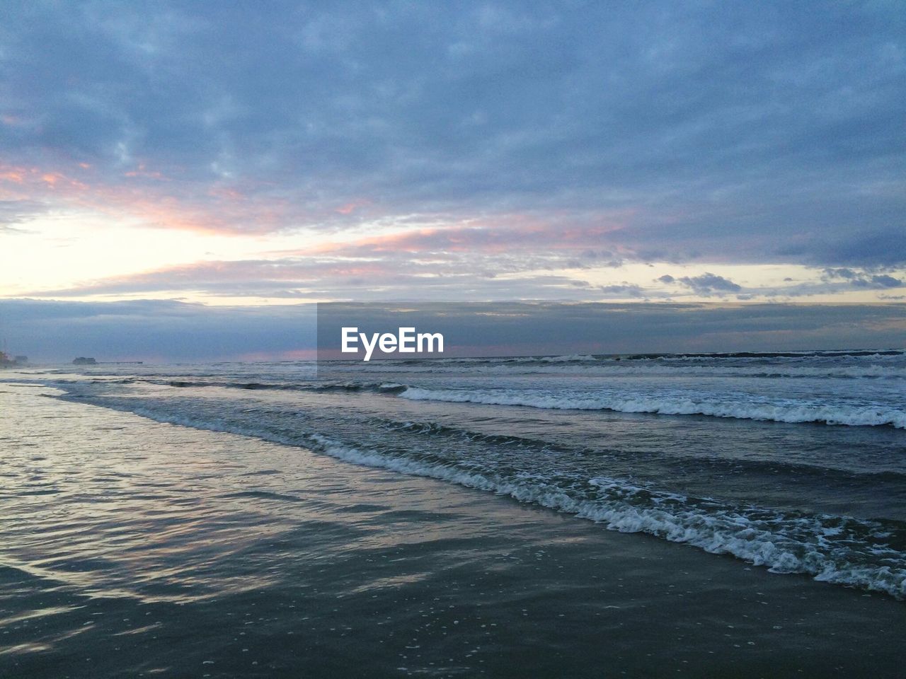 SCENIC VIEW OF SUNSET OVER CALM SEA