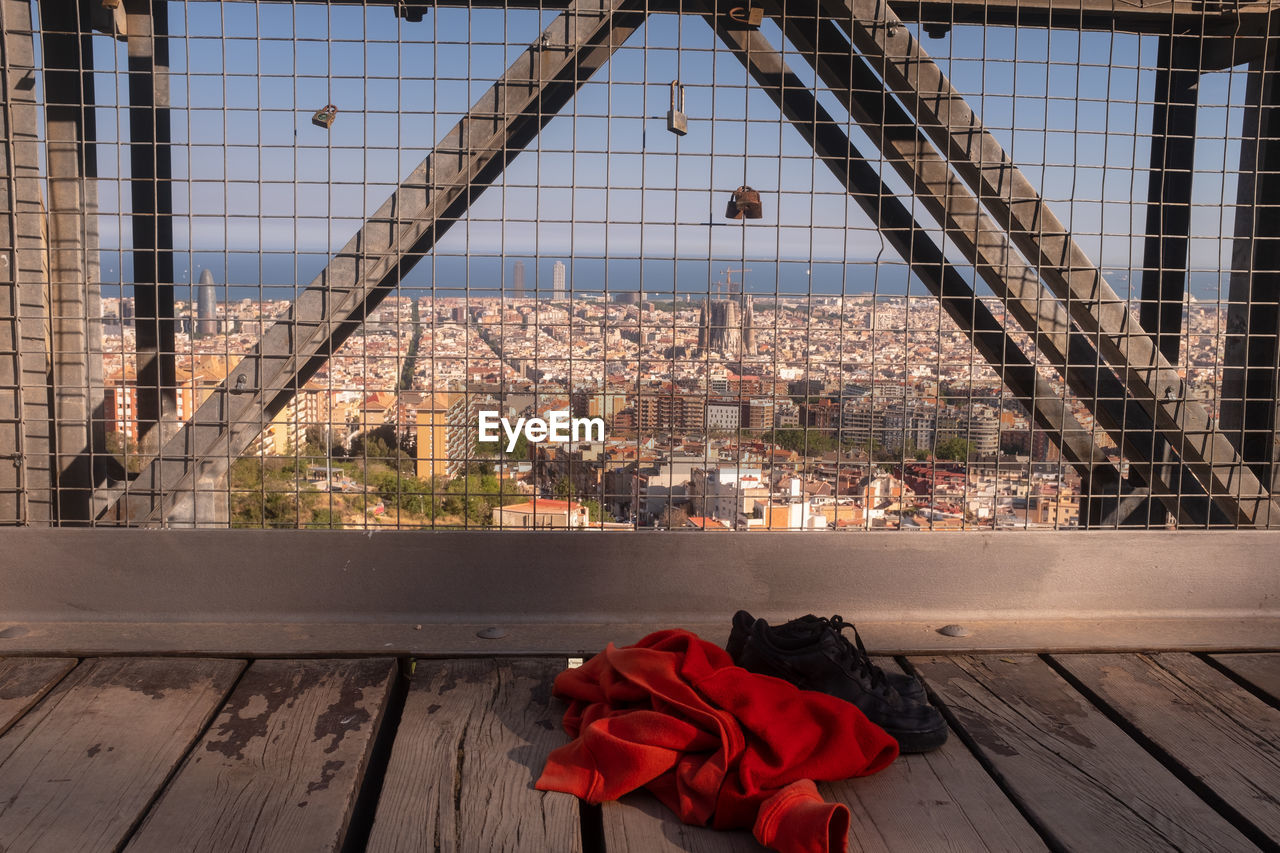 High angle view of red flowering plant against building