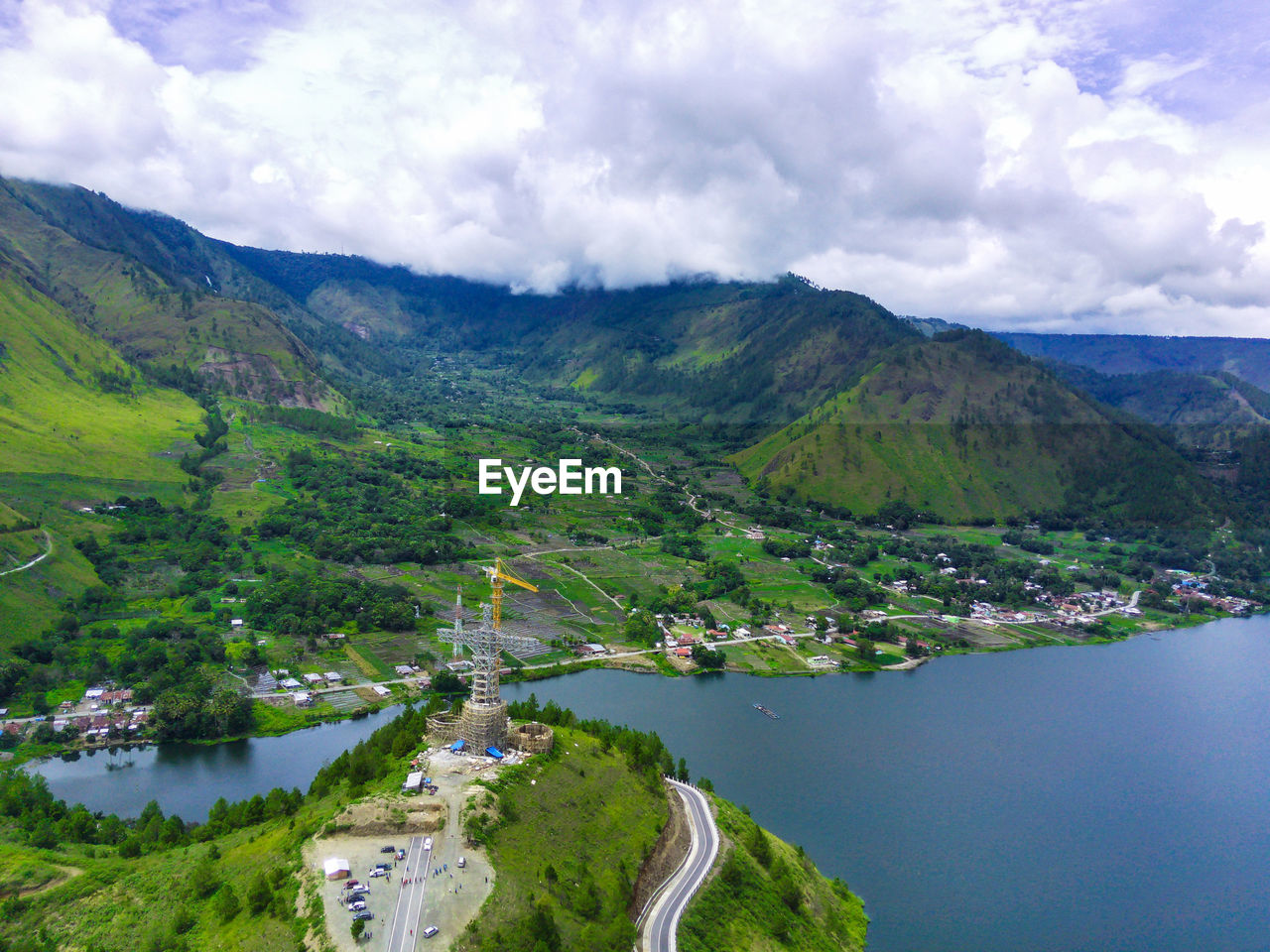 Aerial view of the lake against the mountains and the sky