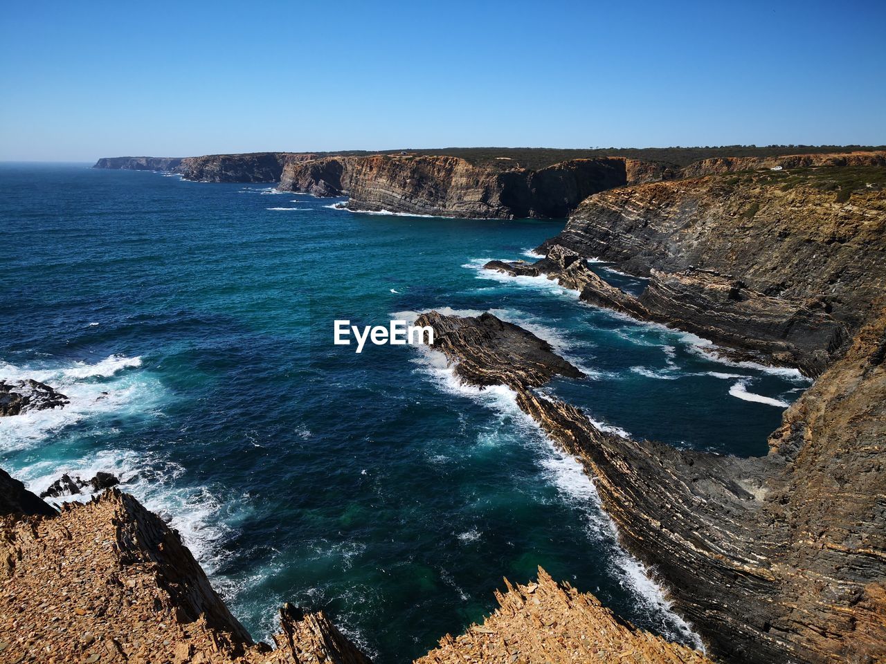 Scenic view of sea against clear sky