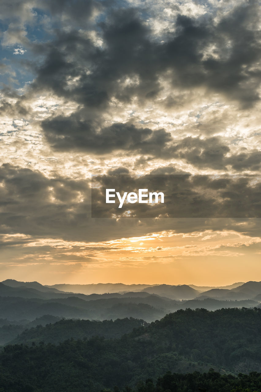 Scenic view of silhouette mountains against sky during sunset